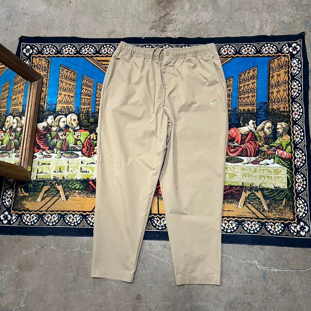 Nike khaki woven pants Size xl like new khaki tan relaxed fit embroidered casual